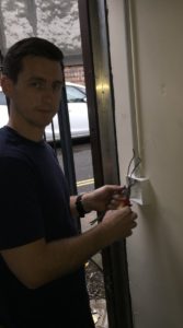 Me using plastic conduit on a wall in a commercial building to prevent chasing and plastering the wall