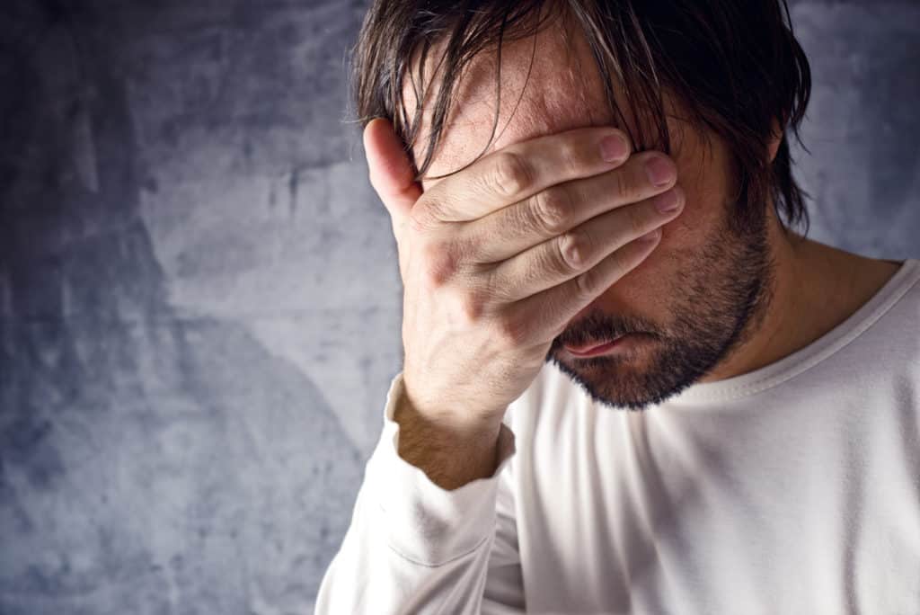 Man frustrated and being let down by unreliable electrician