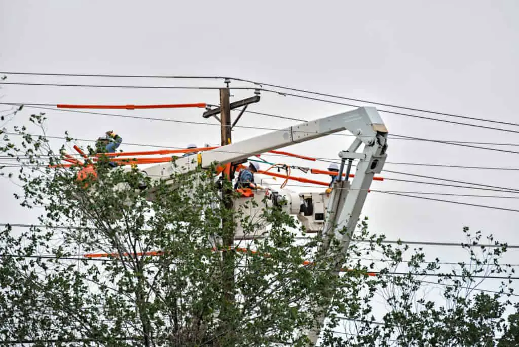 Lineman repairing lines after a storm
