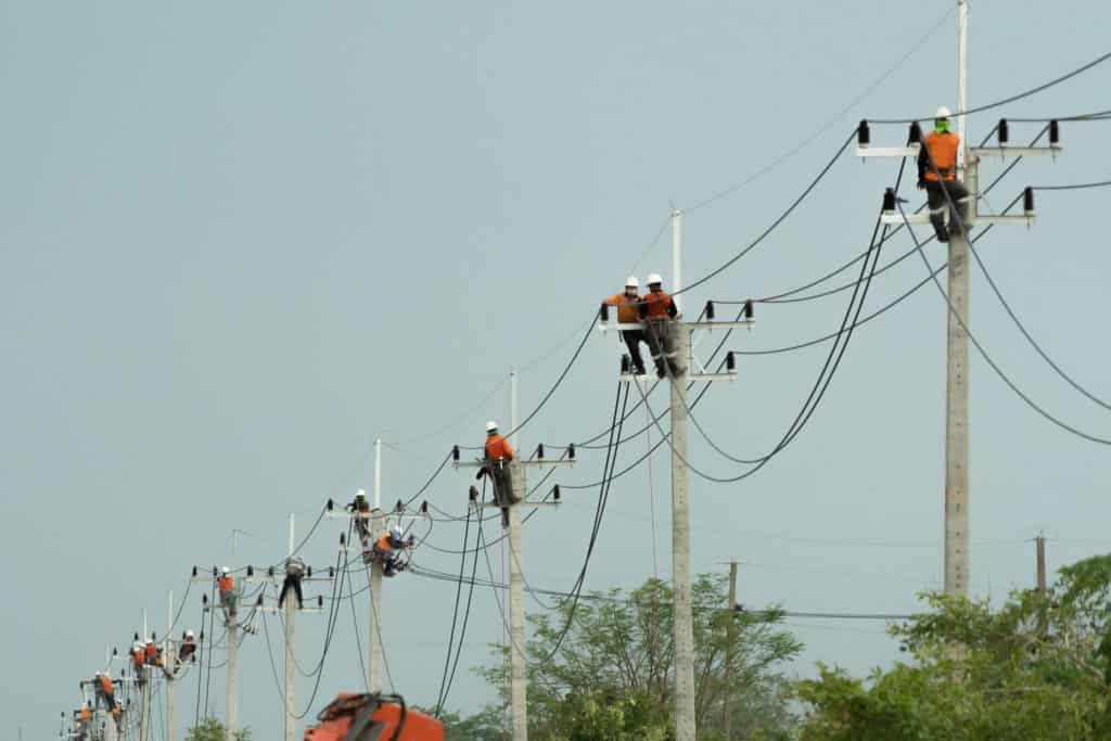 team of lineman working together