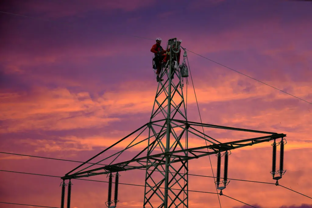 Linemen working at night