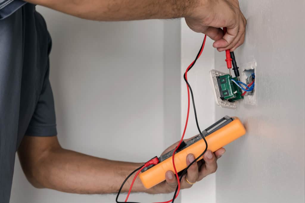 An electrician taking time to test a circuit