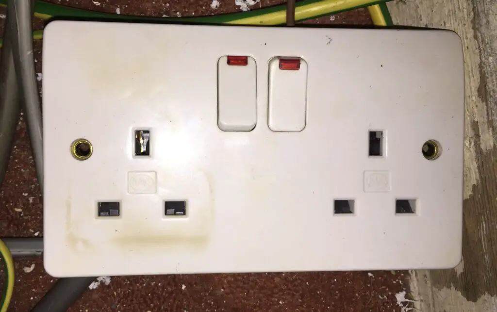 A damaged electrical socket I replaced after discovering during an EICR