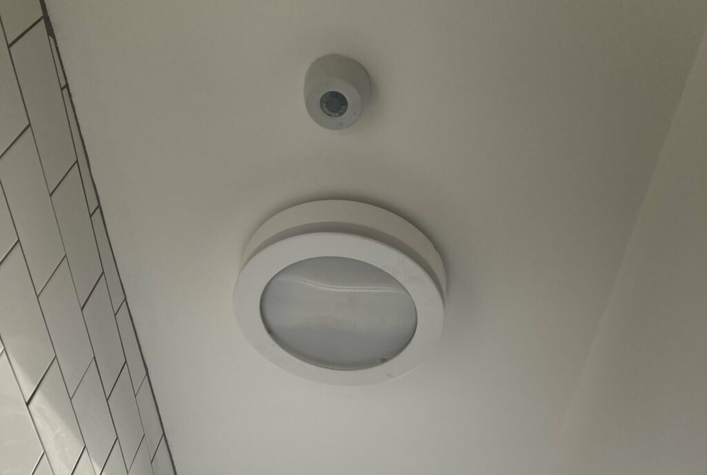 Motion sensor controlling a bathroom light